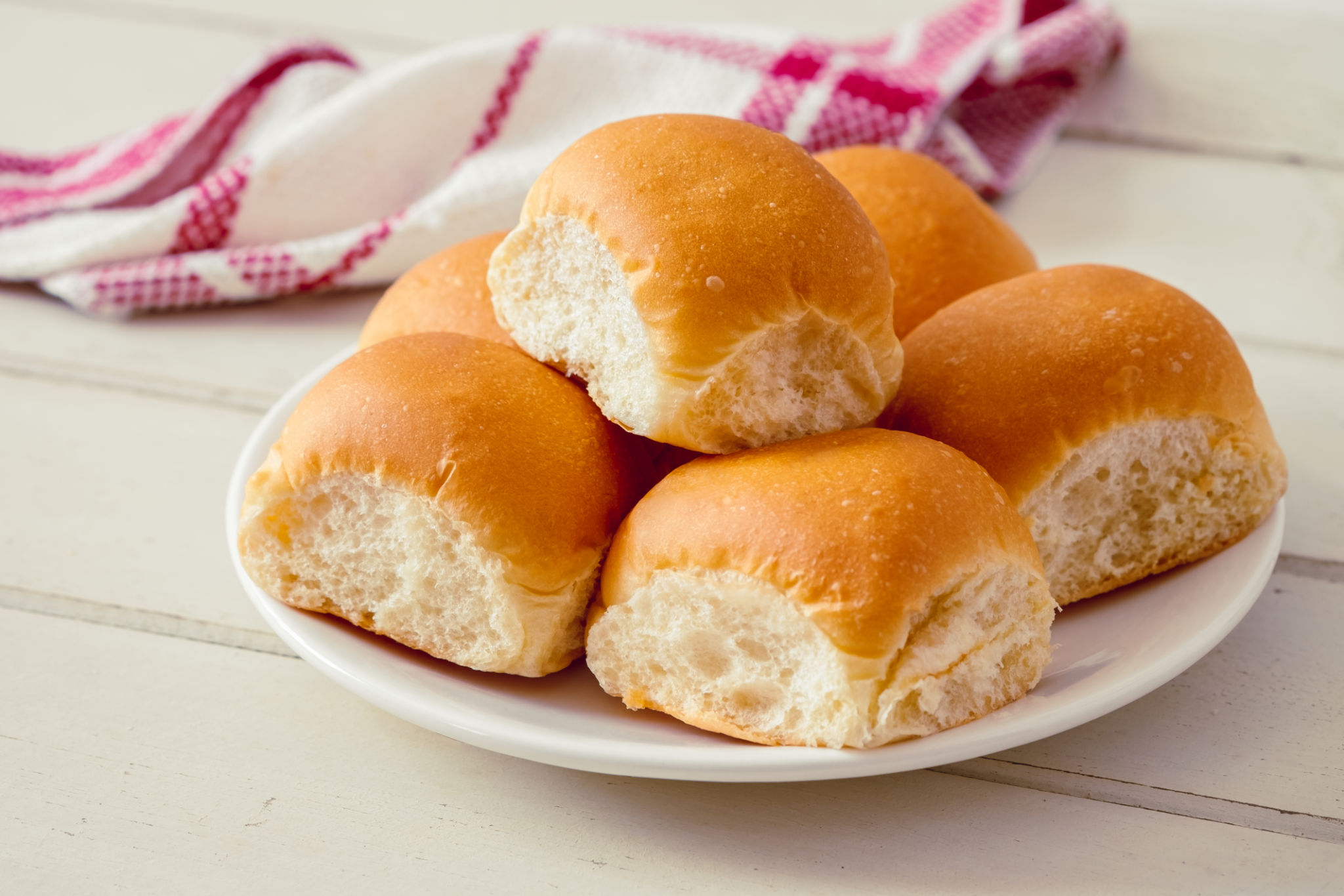 Soft bread rolls on white plate Soft bread rolls on white plate