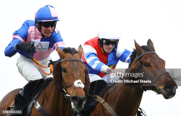 Ben Godfrey riding My Rockstar neck to neck with Paul O'Brien riding Hard Frost on his way to winning the Chard Novices' Handicap Steeple Chase race...