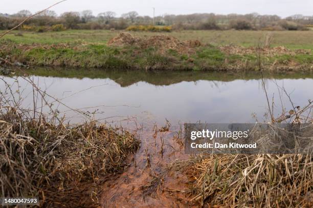 Polluted water running from grounds of the former Northeye prison trickles into a river on April 05, 2023 in Bexhill, England. The Home Office...