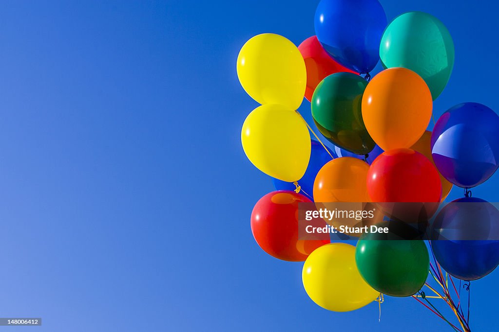 Colorful balloons against blue sky