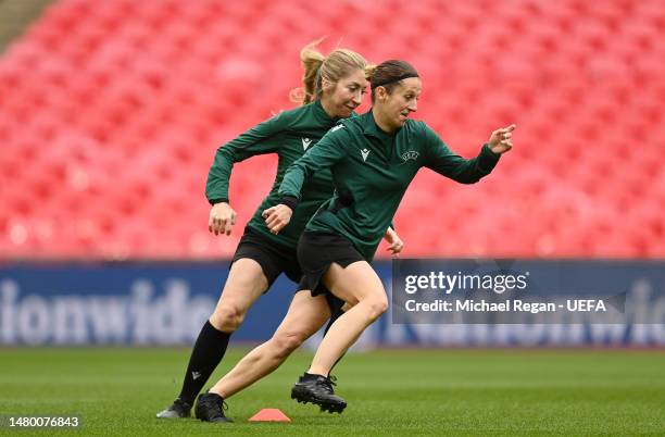 Referees Elodie Coppola and Manuela Nicolosi run during a Referee Team Training Session ahead of Women's Finalissima 2023 match between England and...