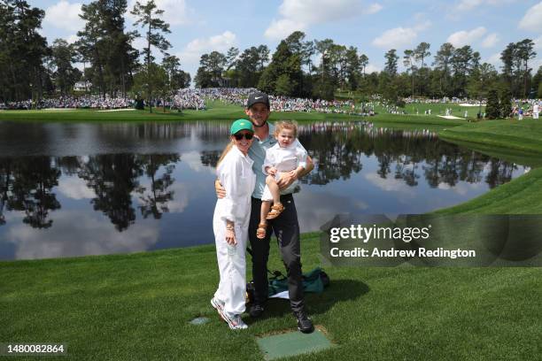 Thomas Pieters of Belgium poses with Stefanie van Steen and their child during the Par 3 contest prior to the 2023 Masters Tournament at Augusta...