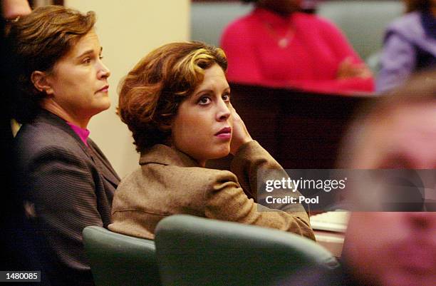 Noelle Bush waits with her aunt Dorothy Bush Koch for the start of her drug court hearing in an Orange County courtroom October 17, 2002 in Orlando,...