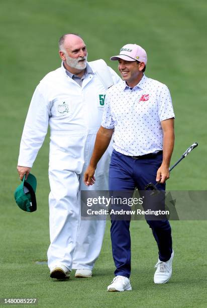 Sergio Garcia of Spain walks down the fairway with chef and caddie José Andrés during a practice round prior to the 2023 Masters Tournament at...