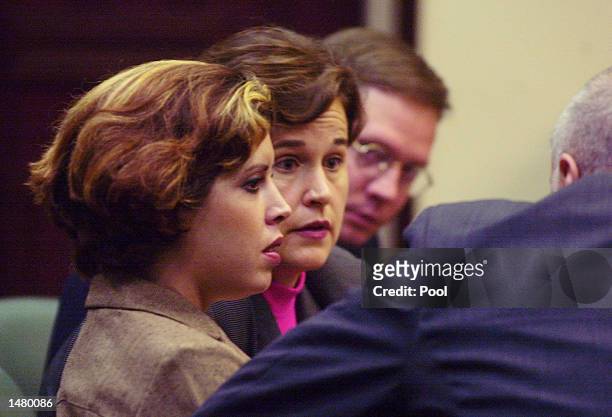 Noelle Bush listens while her aunt Dorothy Bush Koch speaks with attorney Peter Antonacci before the start of her drug court hearing in an Orange...