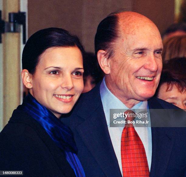 Robert Duvall and Luciana Pedraza arrive at Annual Academy Awards Nominees Luncheon, March 9,1998 in Beverly Hills, California.