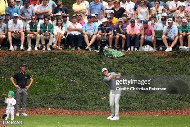 Mackenzie Hughes of Canada plays his shot from the ninth tee during the Par 3 contest prior to the 2023 Masters Tournament at Augusta National Golf...