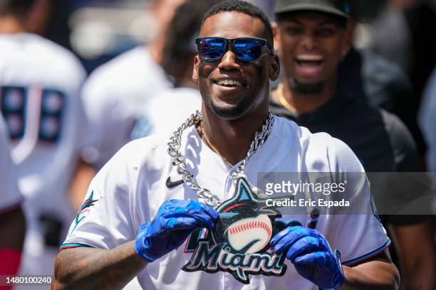 Jorge Soler of the Miami Marlins celebrates in the dugout after hitting a home run during the first inning against the Minnesota Twins at loanDepot...