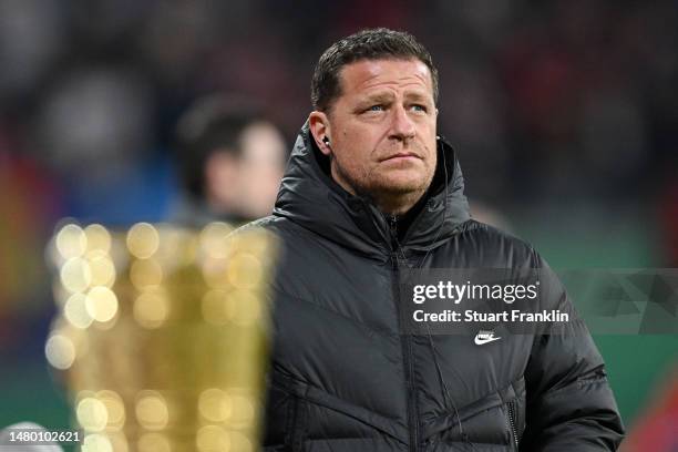 Max Eberl, Sporting Director of RB Leipzig looks on from behind the DFB-Pokal trophy prior to the DFB Cup quarterfinal match between RB Leipzig and...