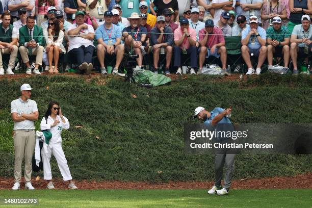 Jon Rahm of Spain plays his shot from the ninth tee during the Par 3 contest prior to the 2023 Masters Tournament at Augusta National Golf Club on...