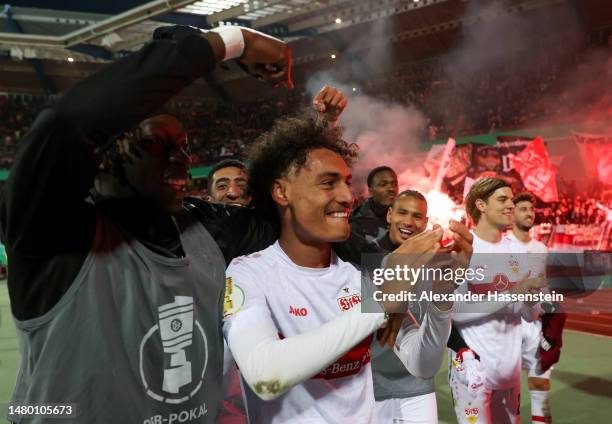 Enzo Millot of VfB Stuttgart celebrates towards the fans with teammates after the team's victory in the DFB Cup Quarterfinal match between 1. FC...