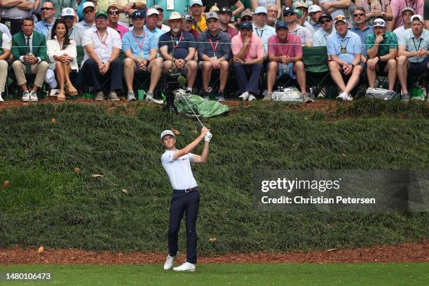 Will Zalatoris of the United States plays his shot from the ninth tee during the Par 3 contest prior to the 2023 Masters Tournament at Augusta...