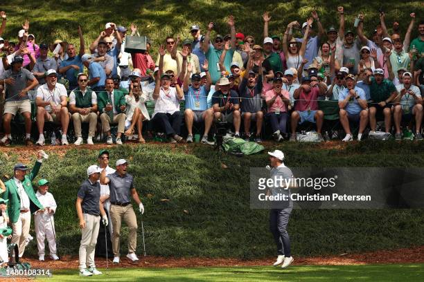 Seamus Power of Ireland celebrates a hole-in-one on the ninth hole during the Par 3 contest prior to the 2023 Masters Tournament at Augusta National...