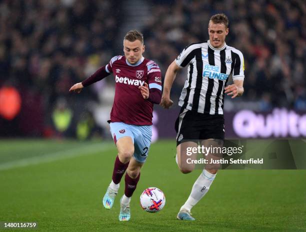 Jarrod Bowen of West Ham United is put under pressure by Dan Burn of Newcastle United during the Premier League match between West Ham United and...