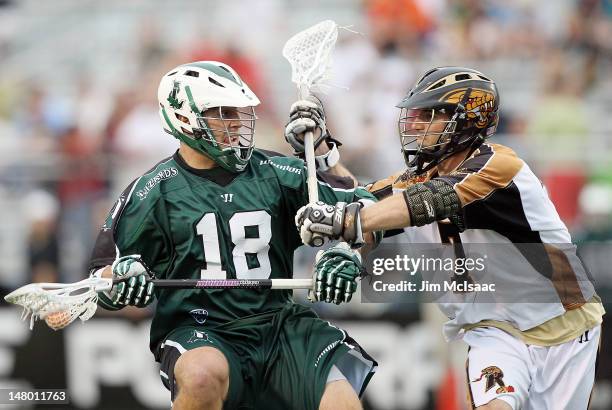 Stephen Peyser of the Long Island Lizards takes controls the ball against Steve DeNapoli of the Rochester Rattlers during their Major League Lacrosse...