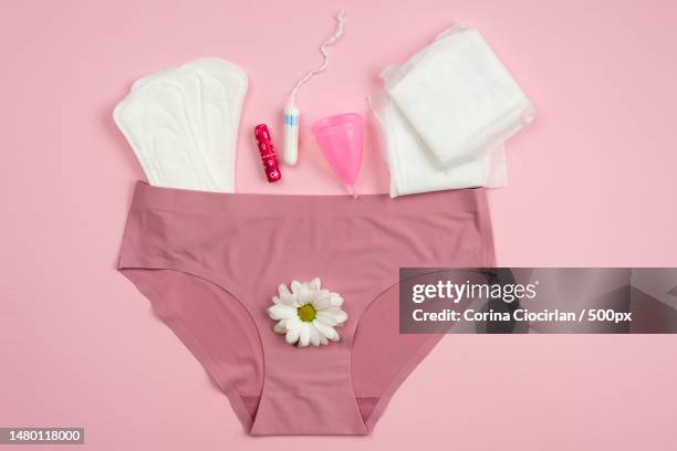 underwear with protective equipment for critical days on a pink background,romania - periods stock-fotos und bilder