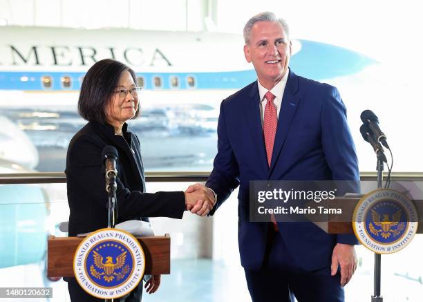 Speaker of the House Kevin McCarthy and Taiwanese President Tsai Ing-wen shake hands in the Air Force One Pavilion at the Ronald Reagan Presidential...