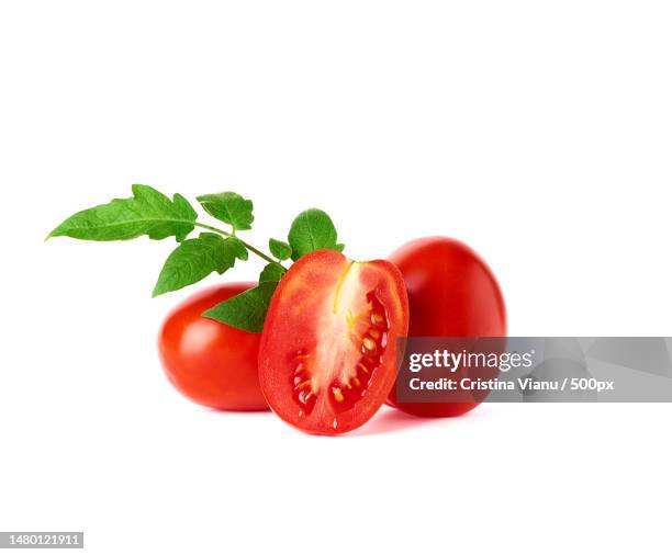 ripe red whole tomatoes and slices on a white background,romania - cherry tomatoes stock pictures, royalty-free photos & images