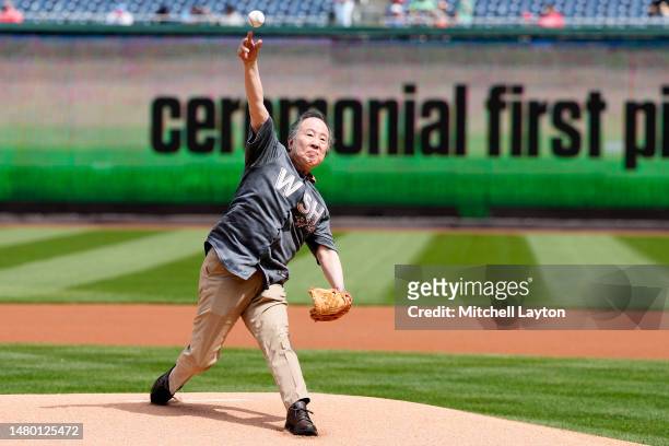 Japanese Ambassador to the U.S. Koji Tomita throws out the first pitch before a baseball game between the Washington Nationals and the Tampa Bay Rays...