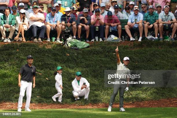 Si Woo Kim of South Korea reacts to his shot from the ninth tee during the Par 3 contest prior to the 2023 Masters Tournament at Augusta National...