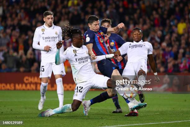 Eduardo Camavinga and David Alaba of Real Madrid battles for possession with Robert Lewandowski of FC Barcelona during the Copa Del Rey Semi Final...