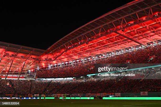 General view inside the stadium as the lights go out during the DFB Cup quarterfinal match between RB Leipzig and Borussia Dortmund at Red Bull Arena...