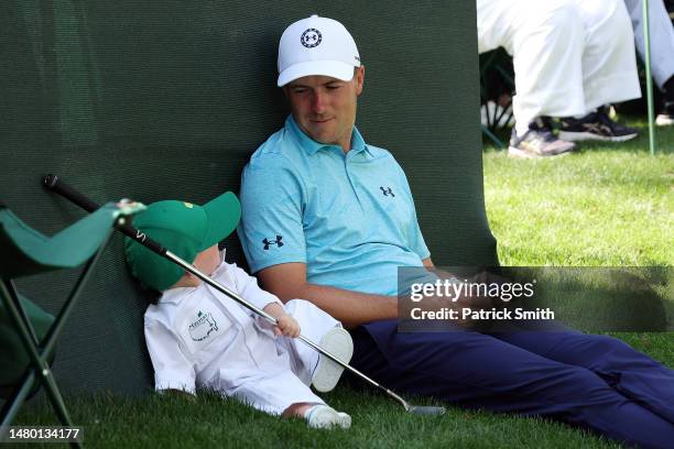 Jordan Spieth of the United States looks on with his son, Sammy Spieth, during the Par 3 contest prior to the 2023 Masters Tournament at Augusta...