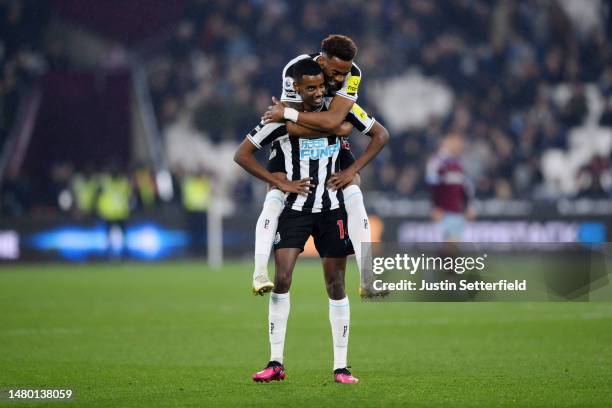 Alexander Isak of Newcastle United is congratulated by teammate Joe Willock after scoring their sides fourth goal during the Premier League match...