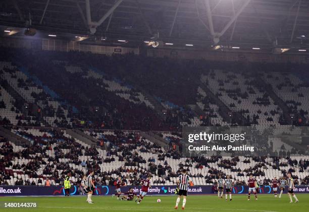 General view inside the stadium as empty seats are seen in the stands during the Premier League match between West Ham United and Newcastle United at...