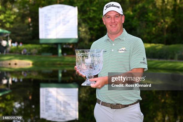 Tom Hoge of the United States poses with the Par 3 contest trophy after winning prior to the 2023 Masters Tournament at Augusta National Golf Club on...