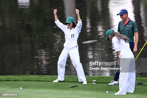 Justin Thomas of the United States and his wife Jillian Thomas celebrate during the Par 3 contest prior to the 2023 Masters Tournament at Augusta...