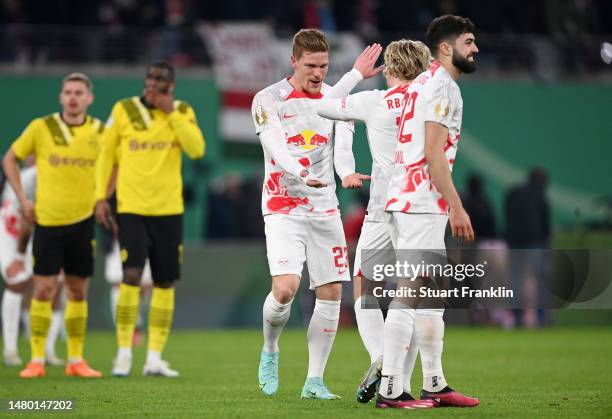 Marcel Halstenberg and Emil Forsberg of RB Leipzig celebrate after the team's victory in the DFB Cup quarterfinal match between RB Leipzig and...