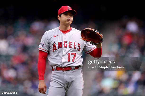 Shohei Ohtani of the Los Angeles Angels reacts during the first inning against the Seattle Mariners at T-Mobile Park on April 05, 2023 in Seattle,...