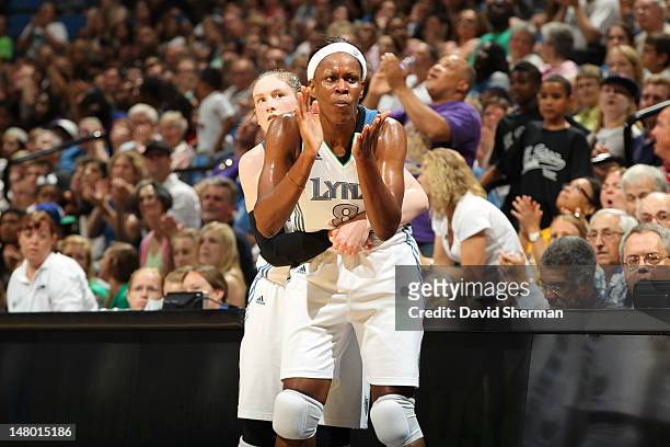 Taj McWilliams-Franklin and Lindsay Whalen of the Minnesota Lynx celebrate on the court during the game against the Connecticut Sun on July 7, 2012...