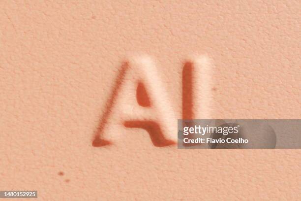 ai - artificial intelligence - letters under human skin - computer absorbing data stock pictures, royalty-free photos & images