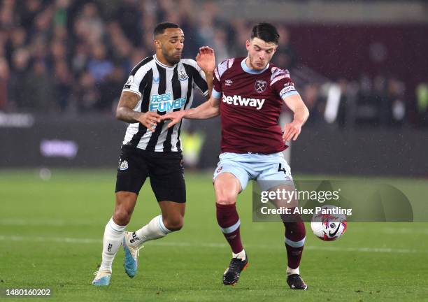 Declan Rice of West Ham is tackled by Callum Wilson of Newcastle during the Premier League match between West Ham United and Newcastle United at...