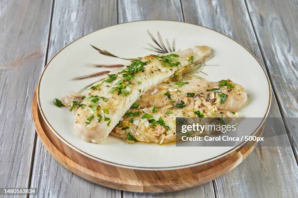 high angle view of food in plate on table,romania - cod stock pictures, royalty-free photos & images