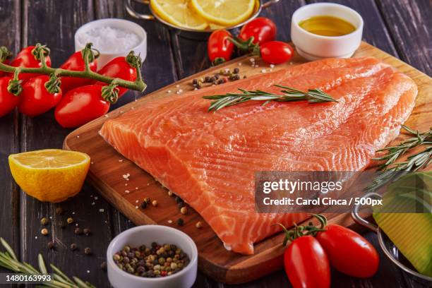 high angle view of salmon with ingredients on table,romania - rustic salmon fillets stock pictures, royalty-free photos & images