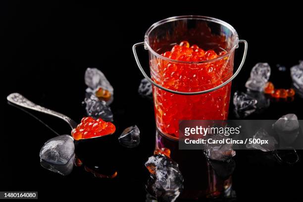close-up of drink in glass against black background,romania - kaviar stock-fotos und bilder