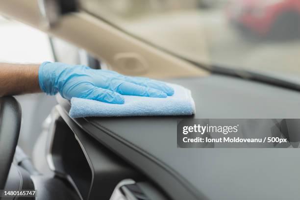 cropped hand cleaning car window,romania - cleaning inside of car stock pictures, royalty-free photos & images