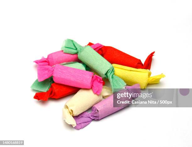 high angle view of multi colored prayer flags against white background,romania - old fashioned candy stock pictures, royalty-free photos & images