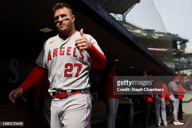 Mike Trout of the Los Angeles Angels gestures toward a fan during the first inning against the Seattle Mariners at T-Mobile Park on April 05, 2023 in...