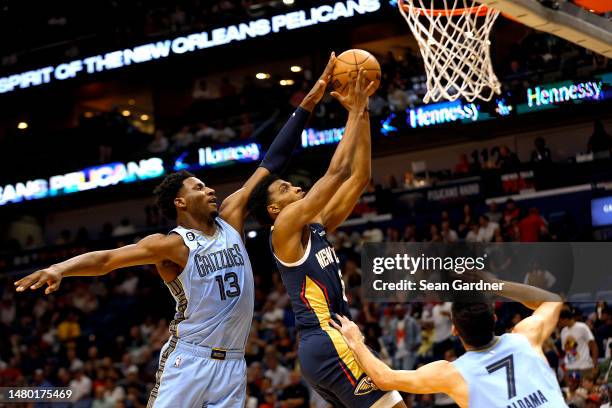 Herbert Jones of the New Orleans Pelicans shoots over Jaren Jackson Jr. #13 of the Memphis Grizzlies during the first quarter of an NBA game at...