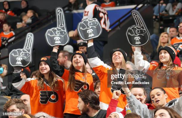 Fans of the Philadelphia Flyers celebrate a goal during an NHL game against the Detroit Red Wings at the Wells Fargo Center on March 25, 2023 in...
