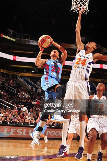 Armintie Price of the Atlanta Dream shoots against DeWanna Bonner of the Phoenix Mercury on July 07, 2012 at U.S. Airways Center in Phoenix, Arizona....