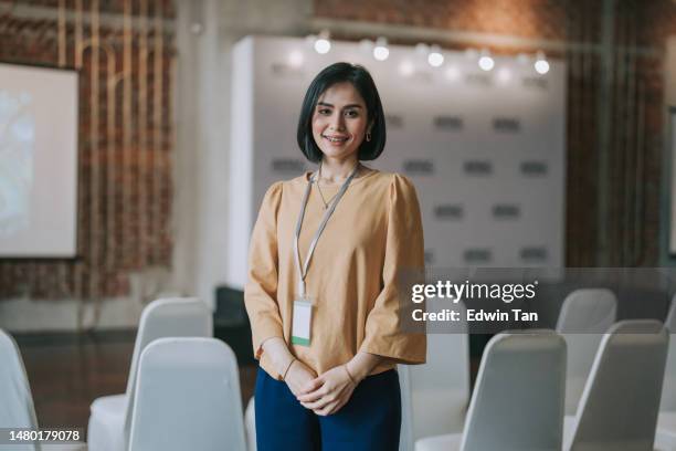 confidence asian malay businesswoman smiling looking at camera in seminar workshop business conference - pride awards ceremony stock pictures, royalty-free photos & images