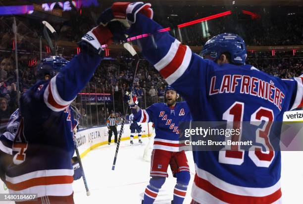 Tyler Motte of the New York Rangers celebrates his second period goal against the Tampa Bay Lightning and is joined by Barclay Goodrow and Alexis...