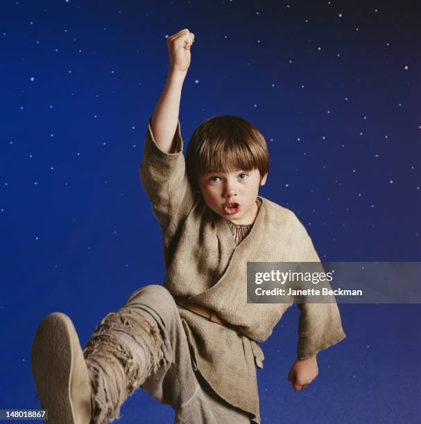 American child actor Jake Lloyd clowns during a photoshot to promote his film, 'Star Wars Episode I: The Phantom Menace,' Los Angeles, California,...