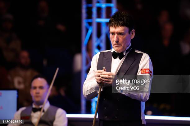 Jimmy White of England chalks the cue in the second round match against Martin O'Donnell of England on day 3 of the Cazoo World Championship 2023...