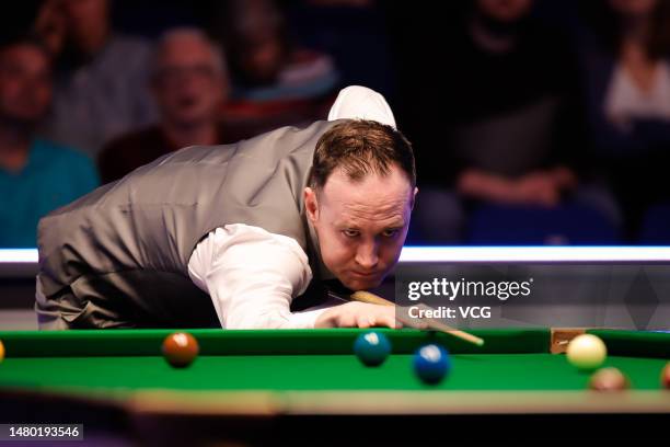 Martin O'Donnell of England plays a shot in the second round match against Jimmy White of England on day 3 of the Cazoo World Championship 2023...